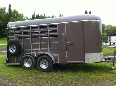 8K AXLES, BLACK ALUM WHEELS, SPARE, RUBBER MATS, PLEXIGLASS, CENTER GATE AND SLIDER. . Horse trailers for sale in mn